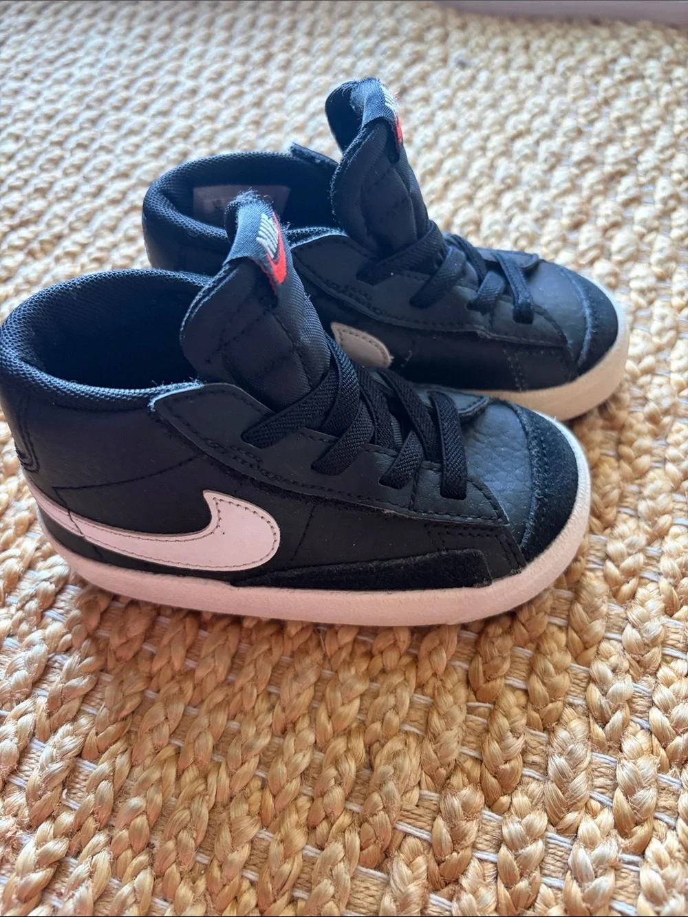 Nike Kids Black Sneakers with White Swoosh and Pink Accent